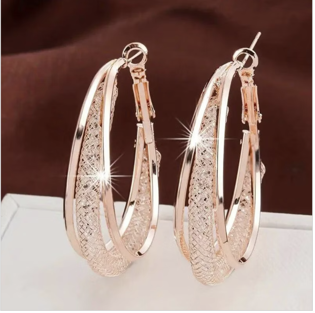 The Aurelia Crystal Hoops in Rose Gold Tone, styled as a pair.