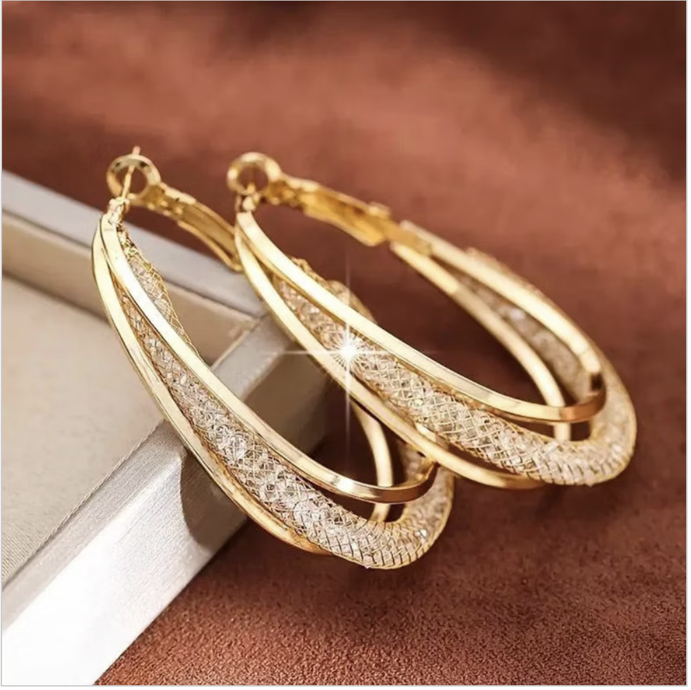 The Aurelia Crystal Hoops in Gold Tone with rhinestone crystal detailing.