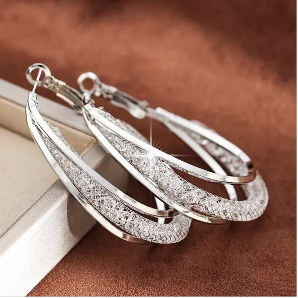 Close view of The Aurelia Crystal Hoops in Silver Tone, showing the rhinestone crystal detailing.